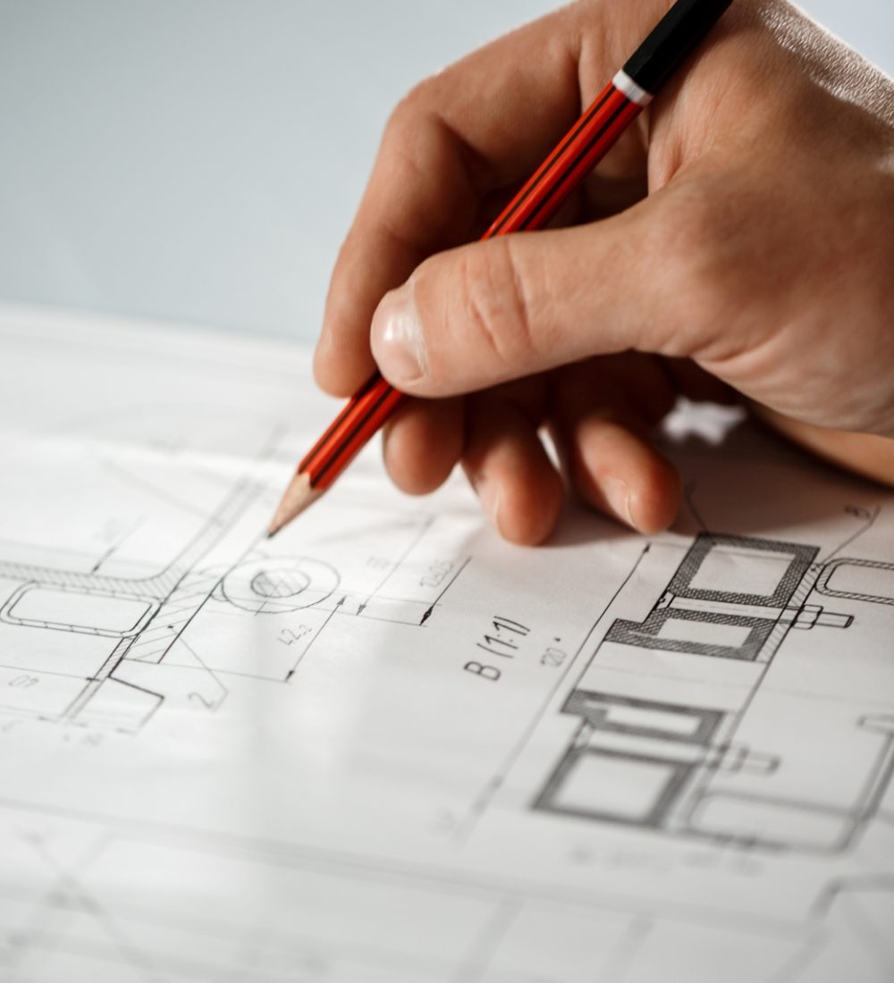 close-up-worker-s-hand-drawing